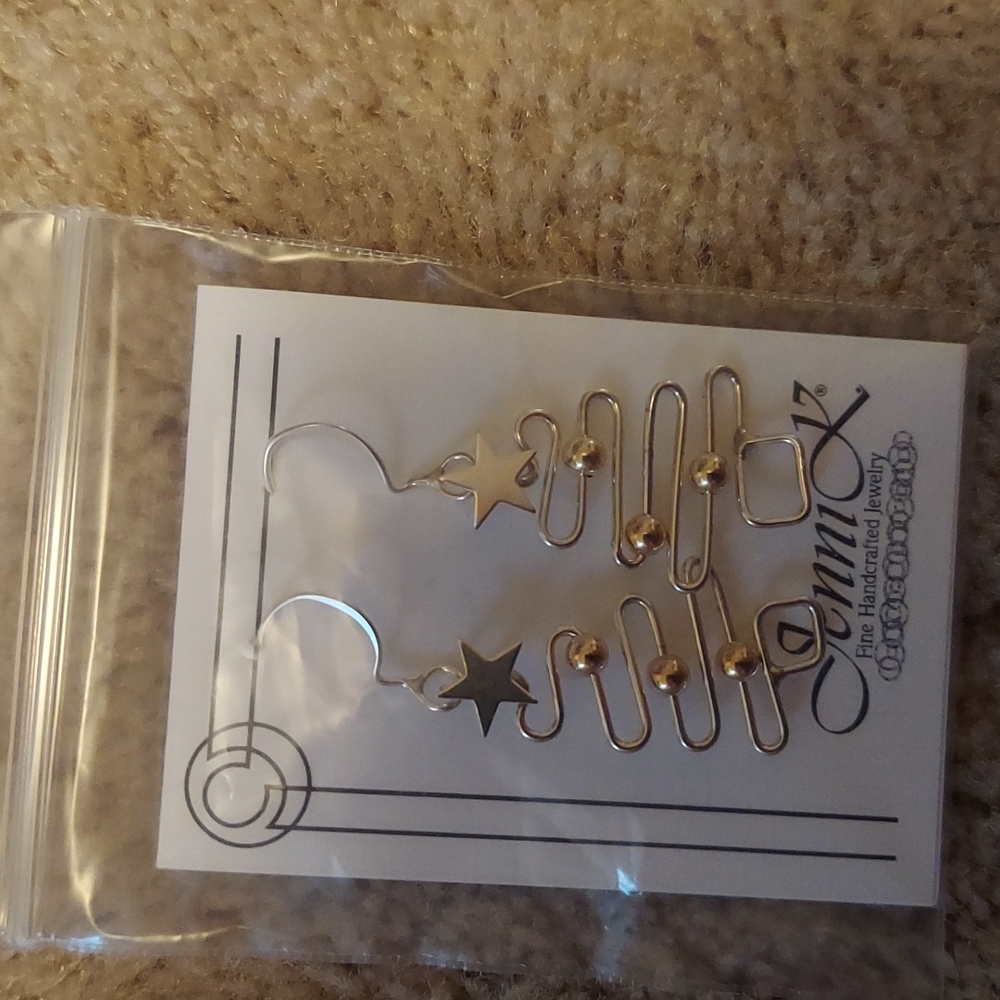 Jenni K ear rings brand new